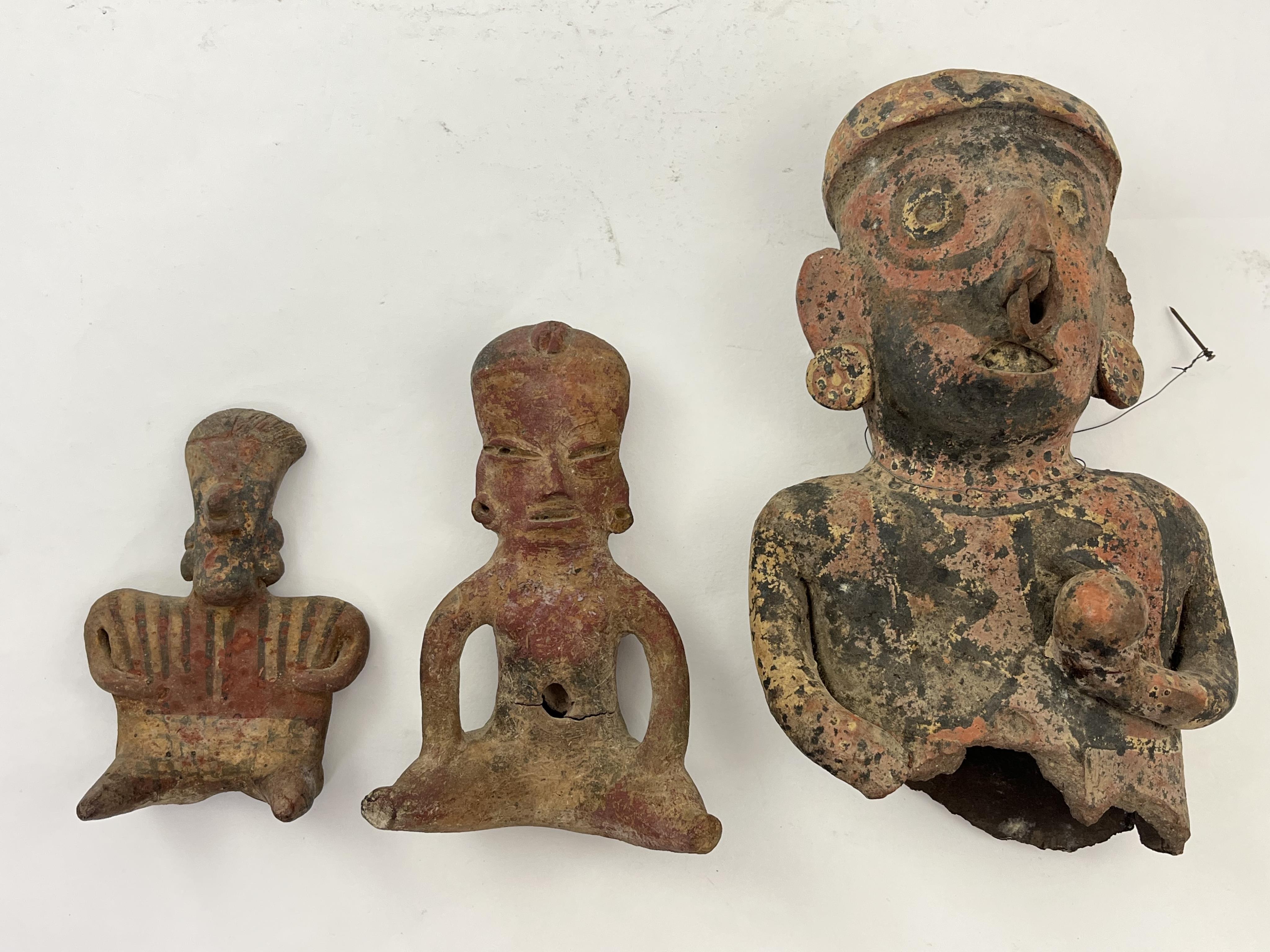 A group of three Pre-Columbian Nayarit polychrome seated figures, Western Mexico, 200 BC - AD 250